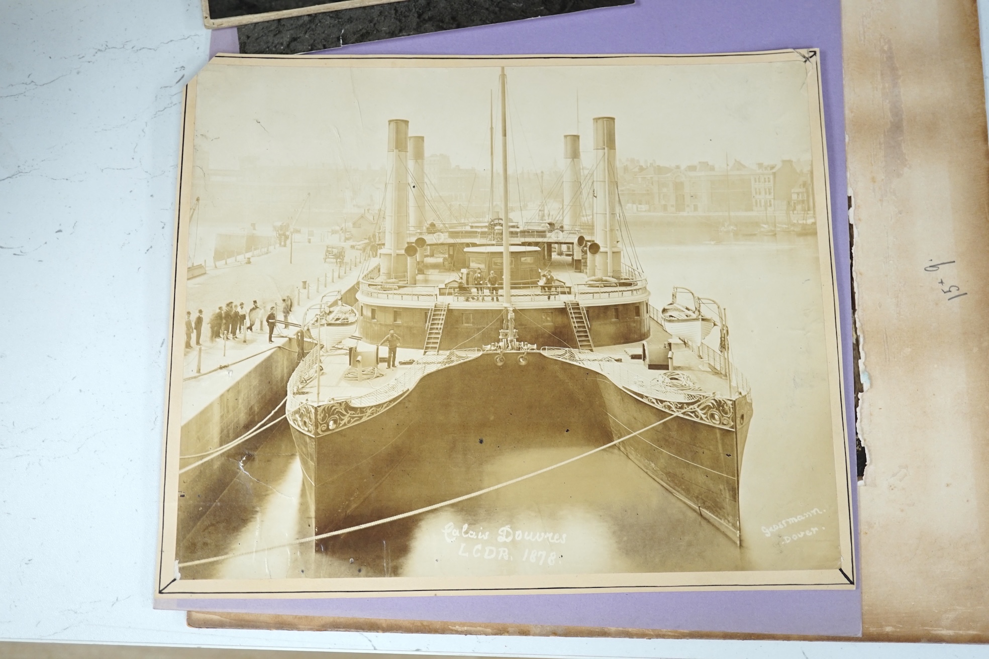 A group of vintage black and white photographs; Steam ship 'Atrato', twin-hulled steamship, Circus horses, Circus pony/dog act & vintage car on a London street, largest 31 x 39cm, unframed. Condition - fair